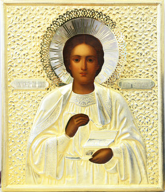 Старинная икона "Святой великомученик целитель Пантелеймон" в серебряном окладе