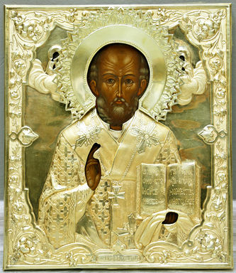 Старинная икона "Николай Чудотворец" в окладе с цветочным орнаментом в стиле модерн