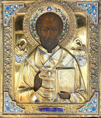 Старинная икона Николая Чудотворца в серебряном окладе с эмалью