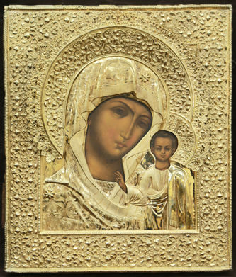 Старинная икона "Казанская Божья Матерь" в окладе с цветочным орнаментом